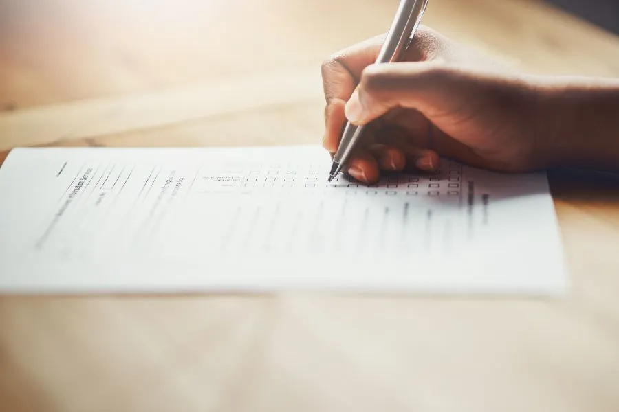 person filling out a survey